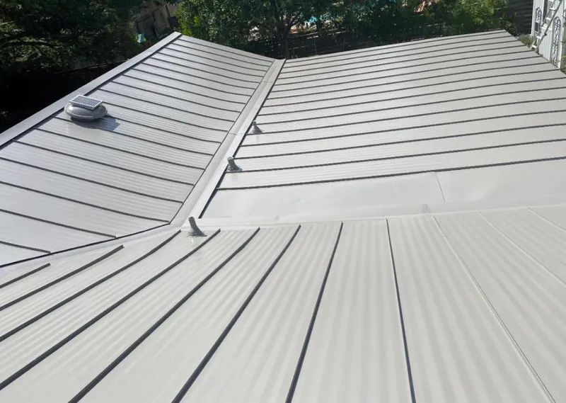 Solar attic fan installed on a metal roof for Roof Ventilation in Mililani Mauka