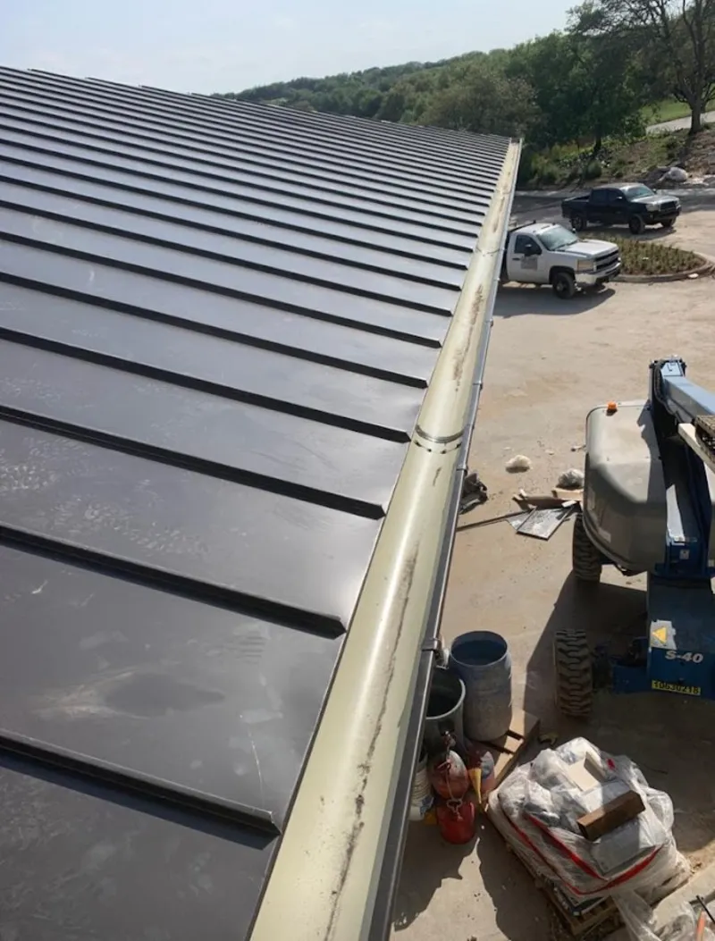 Standing seam panel and gutter detail on a metal roofing jobsite in Mililani Mauka